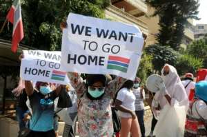 Gambian workers in Lebanon protest at their consulate pleading to be taken home. By ANWAR AMRO (AFP)