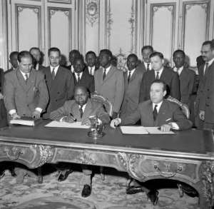 Gabonese Prime minister Leon M'ba and French Prime minister Michel Debre sign an agreement between France and Gabon in 1960. By (AFP/File)