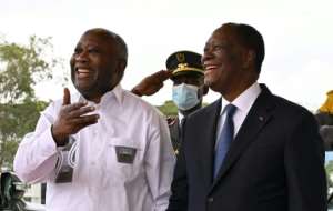 Gbagbo and Ouattara smiled for the cameras, but they may yet soon be engaged in another political battle. By Issouf SANOGO (AFP)