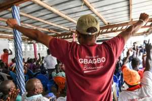 Gbagbo supporters celebrate after International Criminal Court confirmed his acquittal. By SIA KAMBOU (AFP)