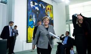 German Chancellor Angela Merkel announced plans to lift some of the restrictions imposed because of the coronavirus pandemic. By Bernd von Jutrczenka (POOL/AFP)