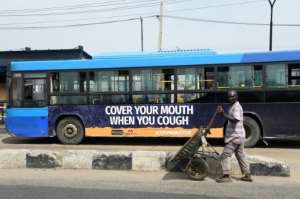 Getting the message across: City authorities have stepped up appeals for social distancing and hygiene. By PIUS UTOMI EKPEI (AFP)