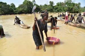 Gold prospectors work in northern Sierra Leone, one of the world's poorest countries