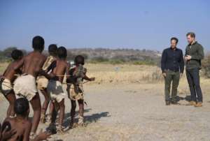 Greeting: Prince Harry and Mike Chase of the conservation charity Elephants Without Borders are given a traditional welcome dance. By MONIRUL BHUIYAN (AFP)