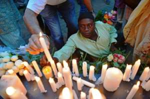 Grief: Kenyans launched prayer vigils for the victims of the massacre. By CARL DE SOUZA (AFP)