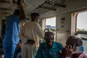Happy: Passengers on the first train connecting Accra to Tema since the line was closed after a derailment in 2017. By RUTH MCDOWALL (AFP)