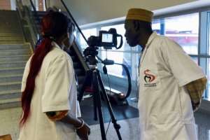 Health workers set up a thermal scanner to screen arriving passengers at Dakar's international airport. By Seyllou (AFP)