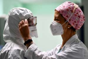 Healthcare systems around the world have been put under immense pressure by the pandemic. By Tiziana FABI (AFP)