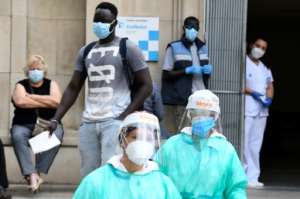 Healthcare workers in the Spanish town of Lerida, where a lockdown order was blocked by a local court. By Pau BARRENA (AFP)