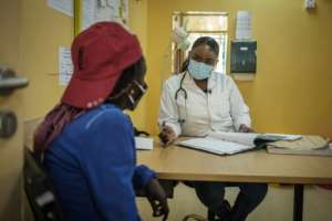 Help: Addiction specialist Angela Thiong'o, right, talks to a 23-year-old heroin user at a clinic run by Doctors Without Borders (MSF) in Karuri. By Yasuyoshi CHIBA (AFP)