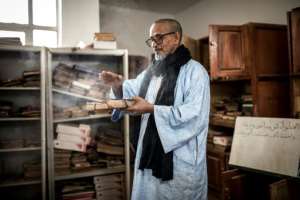 High school headmaster Mouhamedou Ahmadou set up a group to preserve Tichitt's historic manuscripts about 20 years ago but has few resources. By JOHN WESSELS (AFP)