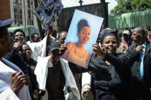 Hundreds gathered for the funerals at Holy Trinity Cathedral in Addis Ababa, weeping and holding up pictures of those who died. By Samuel HABTAB (AFP)