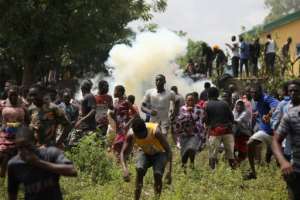Huge crowds ransack food warehouses in Nigeria's capital Abuja. By Kola Sulaimon (AFP)