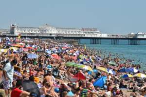 In the southern English resort of Brighton, people have flocked to the beaches as temperatures soar. By Glyn KIRK (AFP)