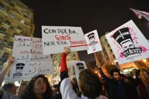 In this file photo from 2013 protesters hold up placards and shout slogans during a demonstration against sexual harassment in Egypt's capital Cairo. By Khaled DESOUKI (AFP/File)