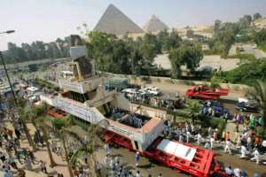 In this 2006 file photo, the massive statue of Ramses II, a 100-tonne, 11-meter-high pink granite colossus, is paraded in Giza as it ends its journey from Cairo to a spot near the Pyramids. By Khaled DESOUKI (AFP/File)