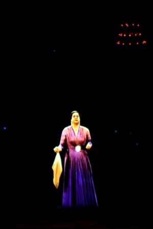 In a nod to her packed concerts of decades ago, the hologram was clad in a bright purple dress and clasped Umm Kulthum's signature handkerchief. By Khaled DESOUKI (AFP)