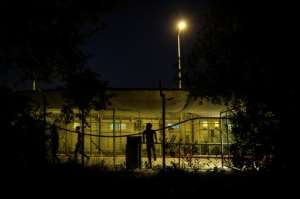 In Moria, many asylum seekers sleep in tents in an olive grove outside the walls of the camp, where restrictions are harder to enforce. By ANGELOS TZORTZINIS (AFP/File)