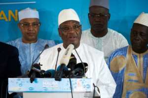 Incumbent president Ibrahim Boubacar Keita (C), pictured August 3, 2018, is the favorite to win, but mounting accusations of fraud and ballot box stuffing have marred the days following the poll. By Michele CATTANI (AFP/File)