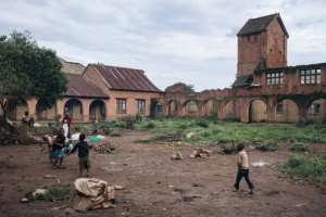 Internally displaced children play in the courtyard of the Minor Seminary, destroyed during the Ituri War (1999-2003), in Fataki.  By ALEXIS HUGUET (AFP)