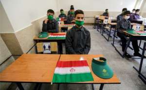 Iran resumed the school year after nearly six months. By ATTA KENARE (AFP)
