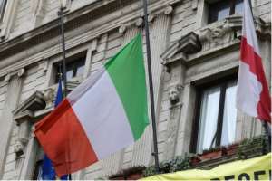Italian flags were flying at half-mast. By Miguel MEDINA (AFP)