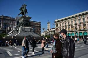 Italy's government has made it mandatory to wear face protection outdoors. By MIGUEL MEDINA (AFP)