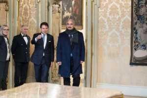 Italy's Prime Minister Giuseppe Conte (3rdL) welcomes Libya's military strongman Khalifa Haftar (R) for talks in Rome. By Handout (Palazzo Chigi press office/AFP)