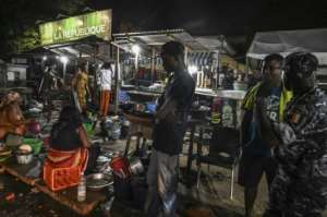 Ivory Coast has detained 450 for failing to respect curfew. By ISSOUF SANOGO (AFP/File)