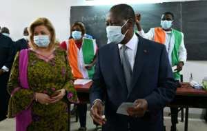 Ivory Coast's incumbent President Alassane Ouattara (R) has urged opponents to give up protests. By Issouf SANOGO (AFP)
