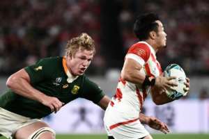 Japan wing Kenki Fukuoka runs to evade South Africa flanker Pieter-Steph Du Toit in the quarter-finals. By Anne-Christine POUJOULAT (AFP/File)