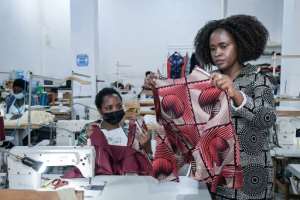 Joselyne Umutoniwase incorporates the geometric designs characteristic of imigongo art in her products. By Simon MAINA (AFP)