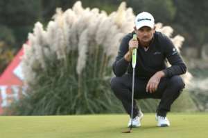 Justin Rose of England lines up his final putt on the 18th green during the final round of the WGC-HSBC Champions, at the Sheshan International golf club in Shanghai, on October 29, 2017