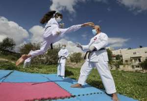 Karate training in the Palestinian territories -- with masks. By HAZEM BADER (AFP)