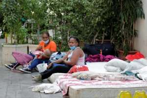 Kenyan women in Beirut camp outside their consulate asking to be repatriated home, some of the thousands of foreign workers wanting to leave Lebanon. By ANWAR AMRO (AFP)