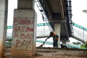 Lagos street graffiti points a finger at Nigerian President Mohammadu Buhari. By PIUS UTOMI EKPEI (AFP)