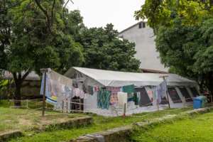 Laundry outside a vaccine centre in Kinshasa in May. Vaccine takeup has been poor in DR Congo - many citizens say they have concerns about the jab or argue that the risk from the virus is not so great. By Arsene Mpiana (AFP)