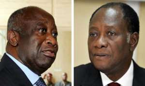 Laurent Gbagbo, on the left, and Alassane Ouattara, at the height of their power struggle in December 2010. By ISSOUF SANOGO, KAMBOU SIA (AFP / File)