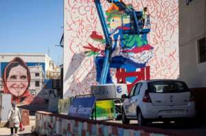 Lhamzi used the side of a house in the working-class district of Yaacoub Al Mansour for his latest work. By FADEL SENNA (AFP)