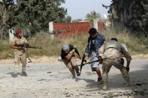 Libyan fighters loyal to the Government of National Accord during clashes with forces loyal to strongman Khalifa Haftar on Saturday. By Mahmud TURKIA (AFP/File)