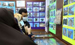 Libyans, shown in January, checking for news of loved ones check belongings of people found in mass graves around Tarhuna, at the forensic medicine department in Tripoli Medical Center. By - (AFP/File)