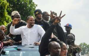 Liberian radio show host and opposition leader Henry Costa (2nd L) is one of those behind the anti-government protests. By Zoom DOSSO (AFP)