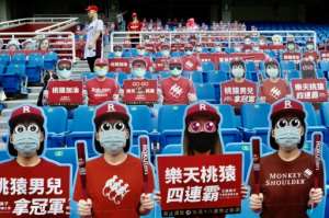 Life-size cutouts in masks replaced fans at Taiwan baseball games. By Sam Yeh (AFP)