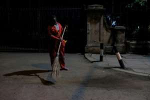 Lilian sweeps the streets of the capital. By Kabir Dhanji (AFP)