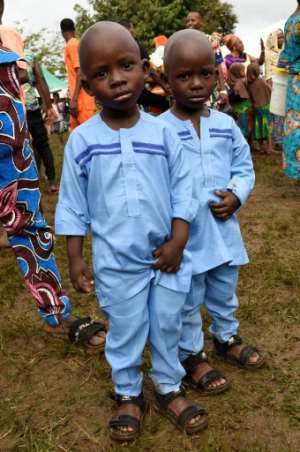 Local people say the high number of twins is due to their diet -- scientists are sceptical. By PIUS UTOMI EKPEI (AFP)