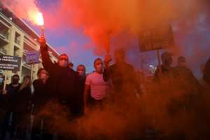 Lockdowns and restrictions have also met with protests -- here by French restaurant owners. By CLEMENT MAHOUDEAU (AFP)
