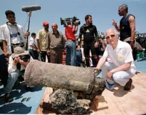 Louis-Napoleon Bonaparte-Wyse (R), a descendant of Napoleon, poses with a cannon retrieved from one of the general's sunken ships in Alexandria. By AMR NABIL (AFP/File)