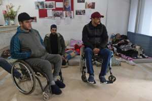 Many of those injured in the uprising are still awaiting recognition and compensation. By FETHI BELAID (AFP)
