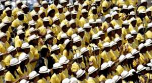 Many faithful were dressed in the yellow and white of the Vatican flag. By TIZIANA FABI (AFP)