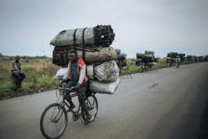 Many people in impoverished DR Congo rely on charcoal as their main fuel, which comes as a steep price for the environment. By ALEXIS HUGUET (AFP)